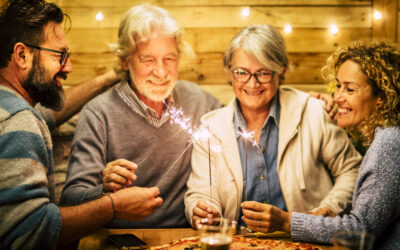 group of two seniors and two adults together having fun with spa